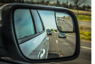 Car following in rear view mirror